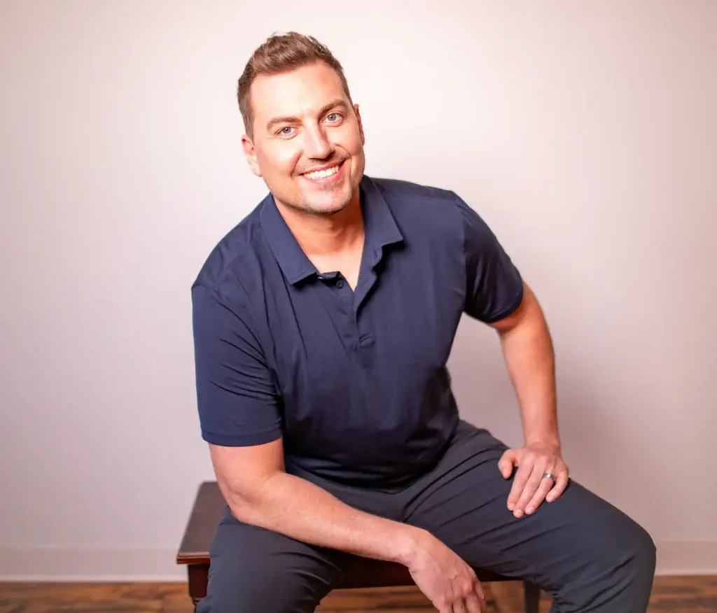 Chiropractor discussing transparent pricing and treatment options with a patient